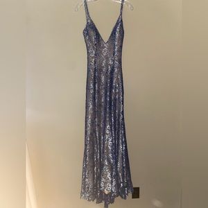 Selling a backless silver/bluish Jovani prom dress size 4